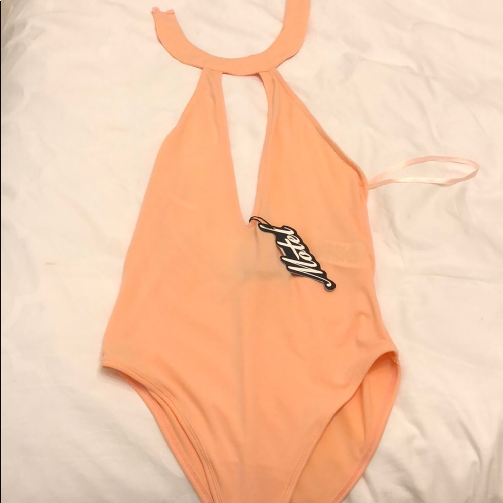 Peach body suit
